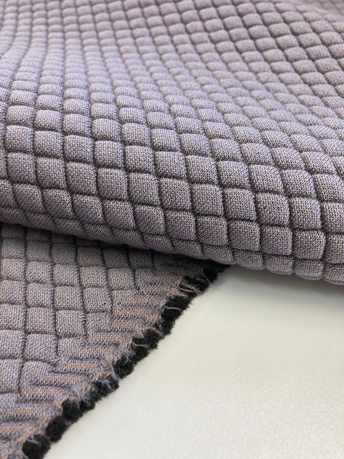 Designed by Kvadrat Febrik Mosaic 2 a knitted three-dimensional upholstery textile